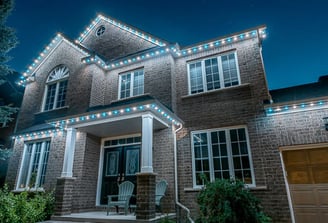 Celebright LED roofline lighting glowing in multiple colours on a GTA house