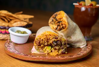 a burrito with a burrito and chips, Street Local at Tacos Mixes Los Angeles
