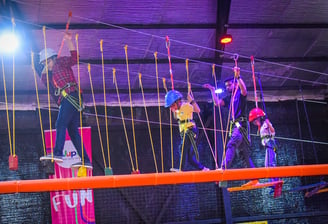 a group of people on a rope - tied rope