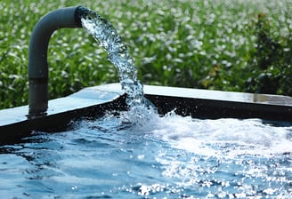 a water fountain with water flowing out of it