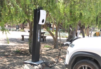 a car charging station with a charging station attached to it