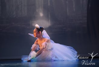 a young girl in a white dress and a white dress