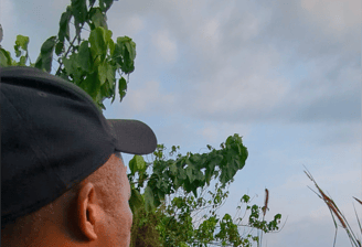 Our guide pointing at wildlife in the Gabonese bush.