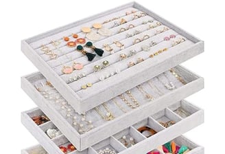 a stack of jewelry with a variety of jewelry