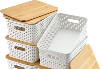 a stack of white baskets with wooden crates