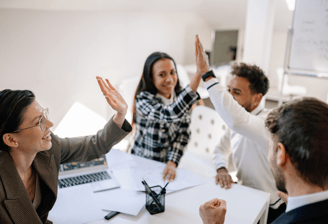 employees high-fiving as it's pay day