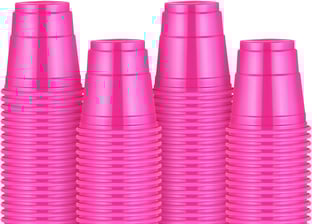 a group of pink cups with a cup of coffee and a cup of coffee