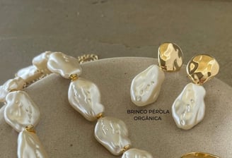 a necklace and earrings with pearls and gold