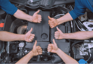 Professional auto repair team at AMI Service & Rental, ensuring quality service with a thumbs-up for