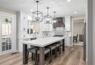 "Custom kitchen renovation with island and tile backsplash in Cumming Georgia"