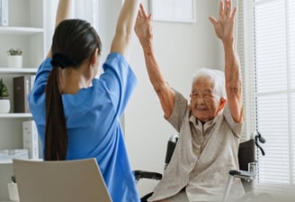 a woman in a wheelchair is doing yoga exercises