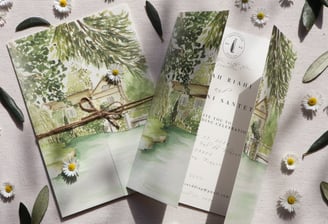 watercolor invitation of the location with flowers and olive leaves