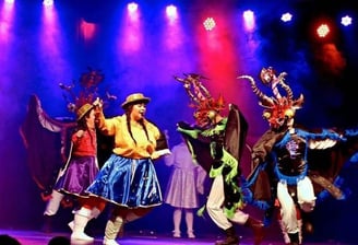 a group of people on a stage with a stage