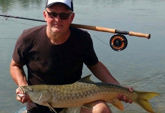 Catching Himalayan Golden Mahseer on the fly.
