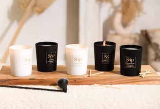 a variety of candles and candles on a wooden board