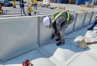 GRP Sectional Water Tank Side Panel Installation from above the Bottom Panel