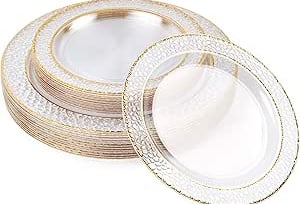 a stack of plates with gold rims and a white background