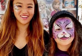 Caroline Face Painting a Purple Tiger at a Birthday Party in Las Vegas