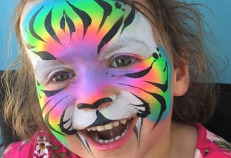 A Rainbow Tiger Face Painting at a Las Vegas Party