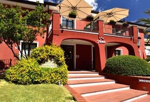 a hotel with a large umbrella and umbrella umbrellas