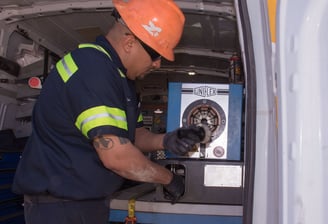 mobile hydraulic hose technician working on site crimping a hydraulic hose