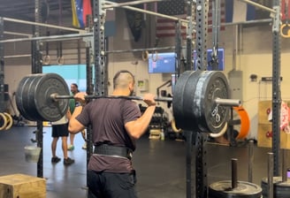 1:1 remote client doing back squats