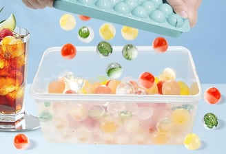 a person holding a tray with a tray of fruit and vegetables
