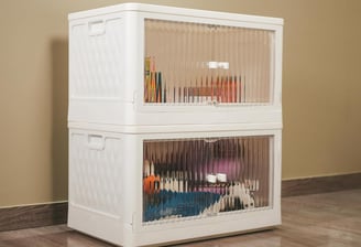a white cabinet with a glass door and a cat in it