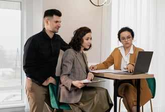 a property manager talking with clients at a table