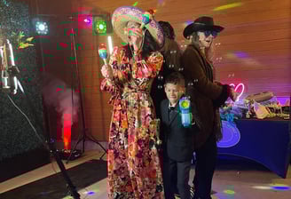 Family having fun on a 360 video booth