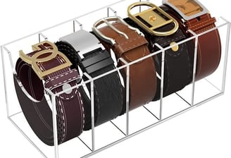 a display case with belts and belts on it