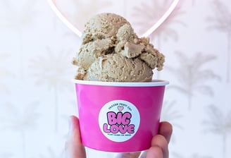 Pink Frozen Fruit Co Cup with a heaped scoop