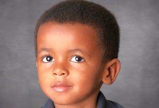 Headshot photo of handsome 2 year-old boy