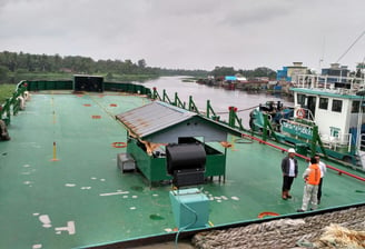 a man standing on a boat in the water