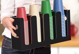 a woman holding a tray with a tray of hair products