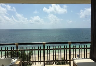 a balcony with a view of the ocean