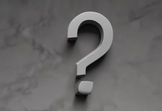 a blue question mark on a pink background
