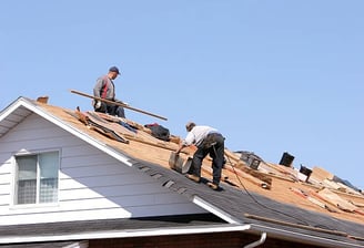 Roofers working on a roof