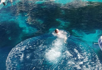 swimming in a quiet cove while sailing from kefalonia