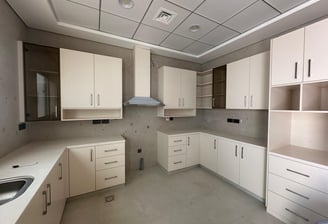 a kitchen with white cabinets and white cabinets
