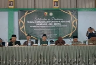 a group of people sitting at a table with a banner on it