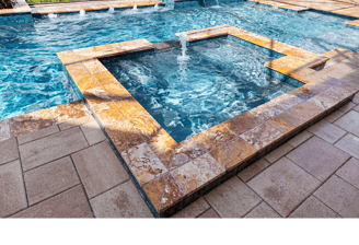 Pool and spa combo pool with tile and paver decking