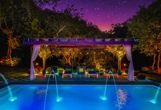 Pergola at night by the pool Houston Custom Enclosures