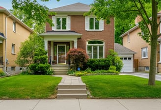 two story home with "539" address Number painted on the front curb.