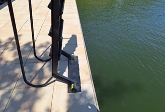 a boat dock with a ladder attached to it