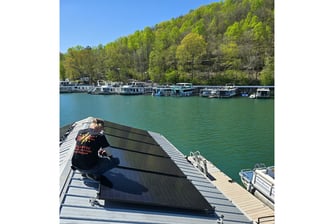 SolarTec installing solar panels on a floating cabin Norris Lake