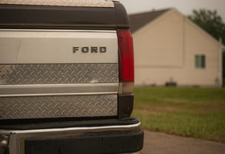 a truck with a truck bed and a truck parked in front of it