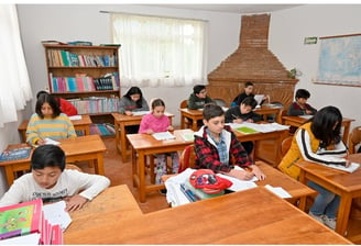 a group of children  in a classroom in the Muslim School