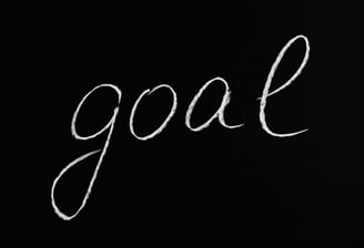 le mot goal sur fond noir pour atteindre des objectifs