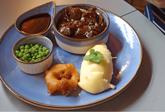 a plate with a bowl of food and a bowl of food